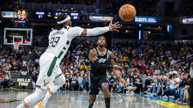 Indiana Pacers guard Buddy Hield (7) passes the ball while Milwaukee Bucks forward Jae Crowder (99)